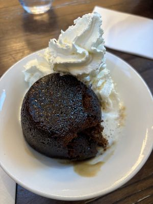 Sticky toffee pudding - notice the less on a teaspoon of syrup.   at Wulf & Lamb Chelsea in London