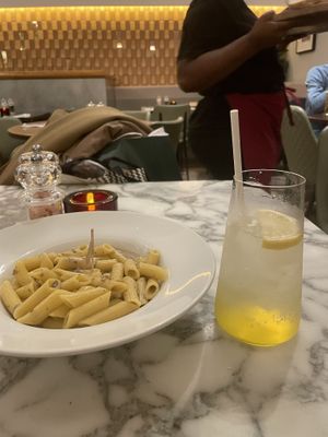 Gluten free pasta and mushroom with passion fruit non alcoholic drink  at Wulf & Lamb Chelsea in London