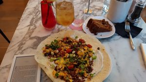Open burrito and carrot cake at Wulf & Lamb Chelsea in London