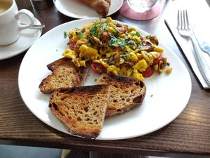 Morning Scramble [£10.95] - Scrambled Ackee with datterini tomatoes, mushrooms, spinach (extra mushrooms cause they didn't have spinach that morning) and peppers with sourdough at Wulf & Lamb Chelsea in London