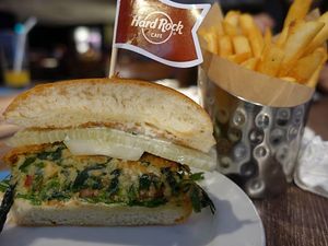 spinach, potato and chickpeas burger neatly sliced into 2  at Hard Rock Cafe - Orchard in Central Singapore