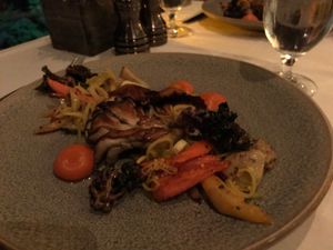 Mushroom steak, seasonal vegetables, smoked carrot purée, lollipop kale, curry pickled leeks at California Market at Pacific's Edge in Carmel-by-the-sea