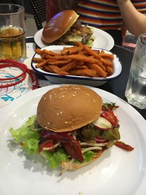 Vegan burger (front) and sweet potato fries😄
The burger in the back is not vegan.  at HD Diner - Saint-Michel in Paris