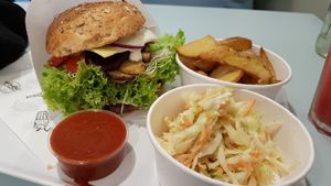 Burger, coleslaw and wedges at Krowarzywa in Wroclaw