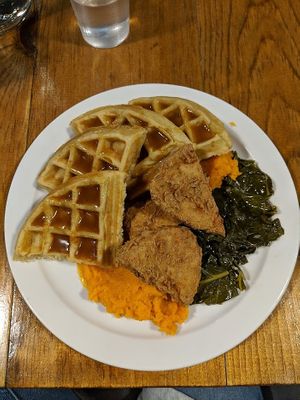 Sweet potato mash, collards, waffles and chicken at The Hogtown Vegan in Toronto