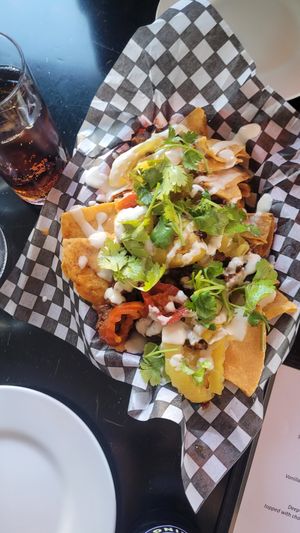 soy 🐷 loaded nachos at The Hogtown Vegan in Toronto