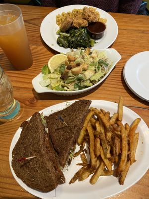 Amazing Caesar salad and Southern combo, vegan Ruben sandwich was just okay. Iced tea on the left is delicious too! at The Hogtown Vegan in Toronto