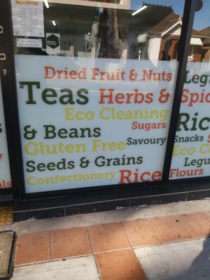 Signage on window at Village Wholefoods & Bulk Foods in Marrickville