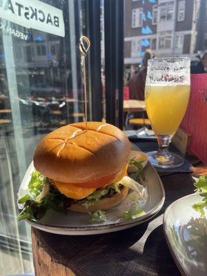 Korean chicken burger with added cheese   at Backstage Vegan Kitchen in Rotterdam