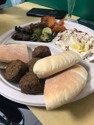 Mixed plate with hummus, falafel and grilled vegetables  at Punto Veg in Ferrara