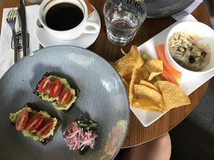 Avo & tomato on toast, hummus served with corn chips & vege sticks  at Moka Bros - K Wah Centre - Maybe closed in Shanghai