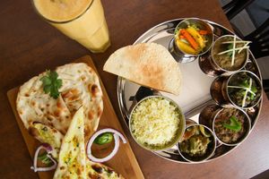 Thali C with Mango Lassi and Naan bread at Hindusthali in Montreal