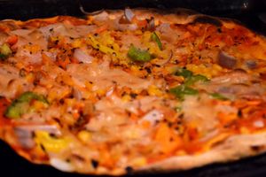 Colorful vegan pizza with vegan cheese! at The VOV in Negombo