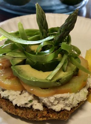 Rawlicious Bagel...chive cream cheeze, heirloom Tom, avo and shaved asparagus.. at Vegan Farmacy in Fort Pierce