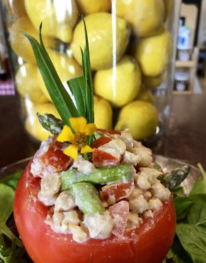 Chickpea, Tarragon, Asparagus smash in a big ripe organic tomato Smashalicious at Vegan Farmacy in Fort Pierce