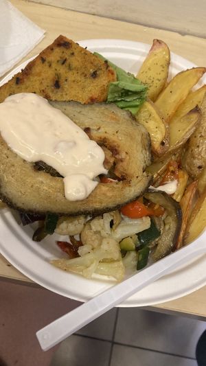 farinata(sotto) seitan(sopra) con mayo ai pomodori secchi.  at Officina Vegana in Naples