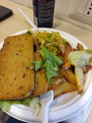 Part 2 of the complete plate. Corn bread, cabbage salad and potatoes with spicy cabbage sauce at Officina Vegana in Naples