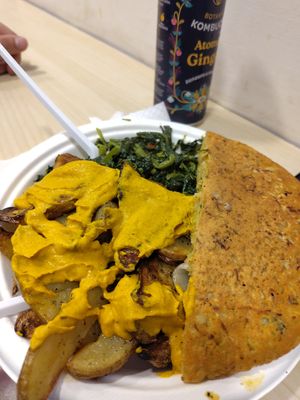 Second part of complete plate, farifritata and sauted greens with potatoes and carrot sauce at Officina Vegana in Naples