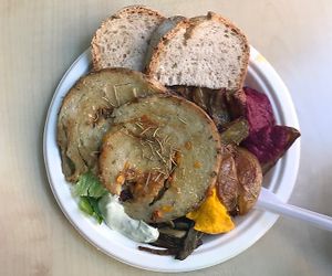 seitan filet with potatos, veggies and bread - a bit too much oil but really good! at Officina Vegana in Naples