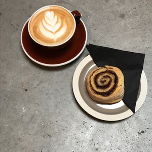 Cappucino and vegan sourdough cinnamon roll at Barbiet in Ghent
