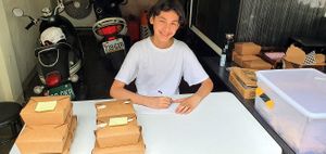 Our son helps out with our take-out orders at Edd's CookHouse - Food Truck in Taichung
