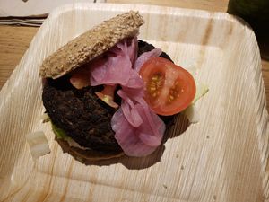 Burger with toppings including pickled onions at CPH - 42°Raw - T2 in Copenhagen