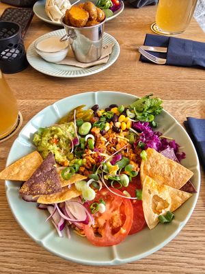 Naked burrito with grenaille potatoes in background at Fryends in Brno