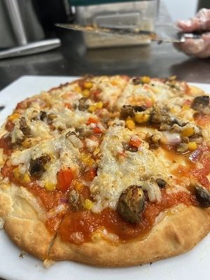 Supreme Pizza - Homemade crust & sauce, veggies, beyond meat sausage, follow your heart mozzarella and parmesan at HaleLife Bistro & Bakery in St Petersburg