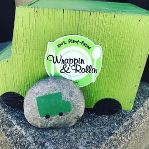 Logo and painted rock at Wrappin & Rollin in Roseburg