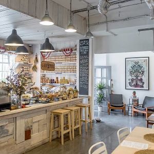 A Greek Oasis hidden in The Old Baths of Hackney Wick.
It could be the set of a Wes Anderson movie, or just a quirky Farm Shop, with sacks of Beans and Lentils on display, homemade preserves, Frankincense and Soaps.  at The Old Baths Cafe - Gaia Pulses in East London