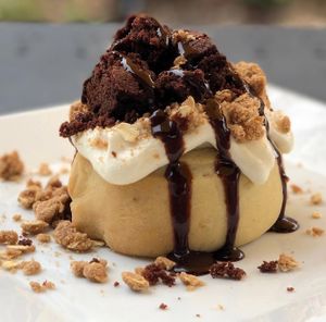 Vanilla Frosting, Brownie Bites, Pie Crumble & Chocolate Sauce! at Cinnaholic in Salt Lake City