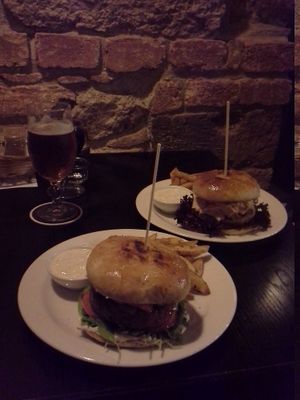 Curry and chilli burgers with fries, vegan mayo, beer and wine. at Tři Ocásci in Brno