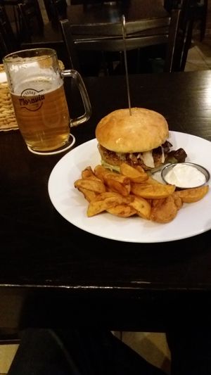 burger and fried potatoes at Tři Ocásci in Brno