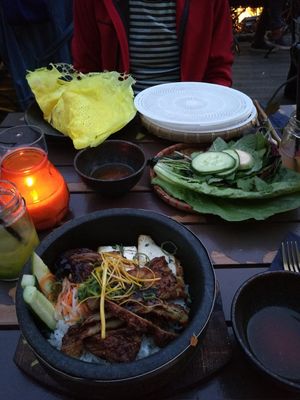 Yellow crepe with tasty green leafs (to make ricepaper rolls)and a "Happy monk"(seitan rice dish) at Con Tho in Berlin