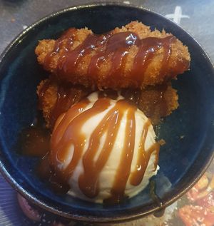 sticky vegan ‘ribs’: Mushroom + soya protein 'ribs' glazed with a sweet + spicy sticky sauce topped with sesame seeds + spring onion at Wagamama - Trafford Centre in Manchester