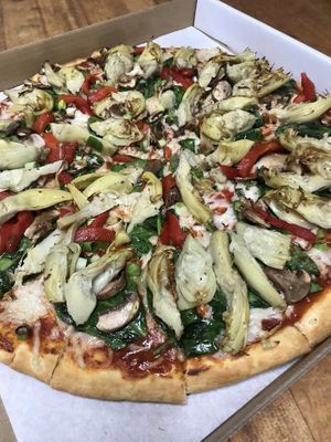 Vegetarian (Vegan) Pizza
Baby spinach, green onions, fresh mushrooms, fresh diced tomatoes, roasted red peppers, artichoke hearts, mozzarella cheese on an artisan style crust with at Bluebird Pizza in Roseburg