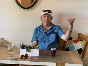 Hungrily waiting after a long snorkel trip  at a'a Roots Health Cafe in Lahaina