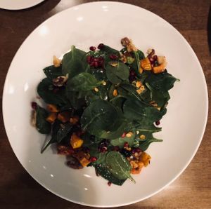 Fall squash salad w/ pomegranate, spinach, savory granola, dried cherries, walnuts, maple-chili vinaigrette at Twisted Fern in Park City
