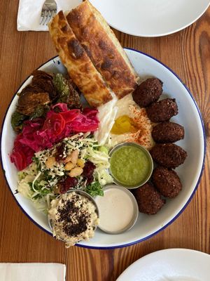 Veggie plate with Brussels sprouts, pickled veg, baba, and extra falafel added at 1000 Figs in New Orleans