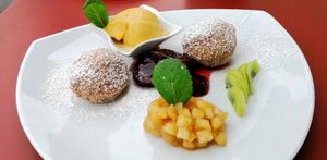 Nougatknödel mit Sorbet, Zwetschgen und Äpfeln at Biohotel Garmischer Hof in Garmisch-partenkirchen