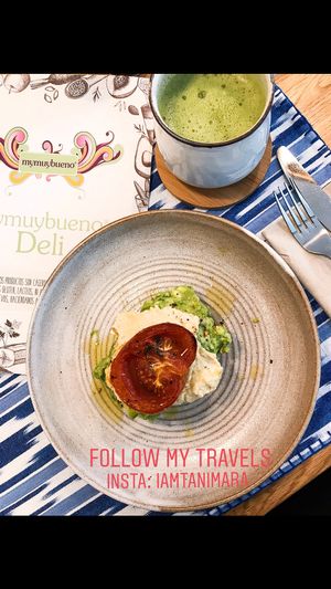 Avocado mash, hummus and tomato w/ coconut milk matcha latté  at mymuybueno Deli in Mallorca