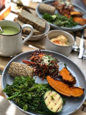 Asian coleslaw, falafel, greens, maple roasted sweet potato, hummus, seeded bread, and a matcha latte... heaven! at mymuybueno Deli in Mallorca