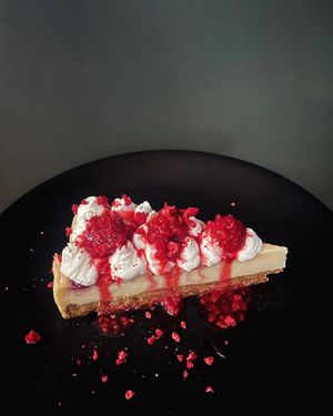 White chocolate and raspberry cheesecake, served with raspberry compote and whipped coconut cream at Green Man's Arms in Carlton