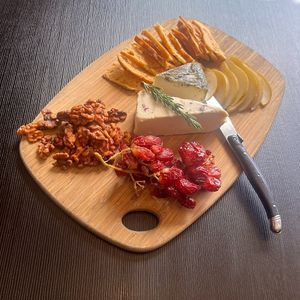 Vegan Cheese board: cashew cheese rolled in Tasmanian botanicals, cashew brie topped with rainbow peppercorns, candied walnuts, salted grapes, caramelised pear, focaccia crisps at Green Man's Arms in Carlton