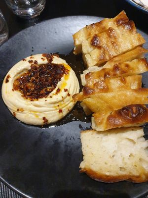 Chilli hummus focaccia $15.00: spongey focaccia sitting in oil, hummus had quite a lot of chilli oil (tasted like the grumpy lady brand) at Green Man's Arms in Carlton