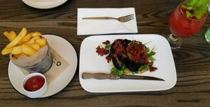 Mushroom open sandwich, hand-cut fries & a spicy tomato juice. at Atticus Finch in Rotorua