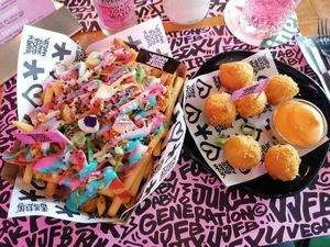 Rainbow fries and mac and cheese balls at Vegan Junk Food Bar - De Pijp in Amsterdam