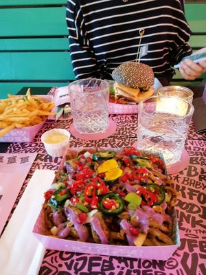 Loaded fries, a burger and a side of fries at Vegan Junk Food Bar - De Pijp in Amsterdam