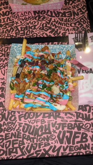 iconic rainbow loaded fries at Vegan Junk Food Bar - De Pijp in Amsterdam