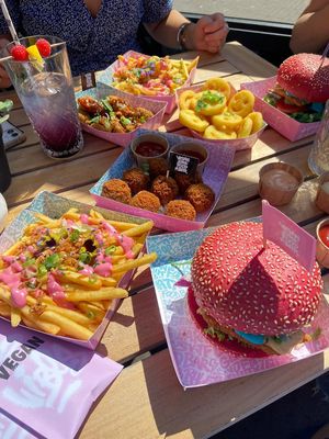We ordered a lot of food to share. Daddy and the Cheezy Smash burgers. Mac & Cheeze Betterballs, Pnut Thai Chik’n Betterballs. And smiley faces.  at Vegan Junk Food Bar - De Pijp in Amsterdam